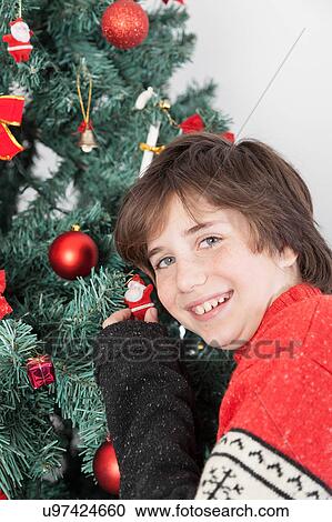 Happy boy beside the christmas tree View Large Photo Image Stock Image - Happy boy beside the christmas tree. Fotosearch