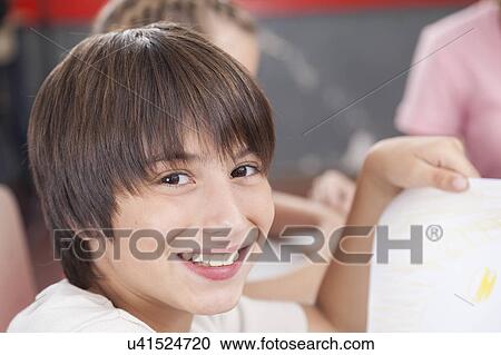 Stock Image - Happy boy with his draw. Fotosearch