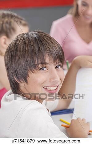 Stock Photo - Happy boy with his draw. Fotosearch
