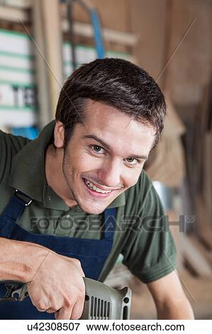 Stock Photo - Happy carpenter. Fotosearch
