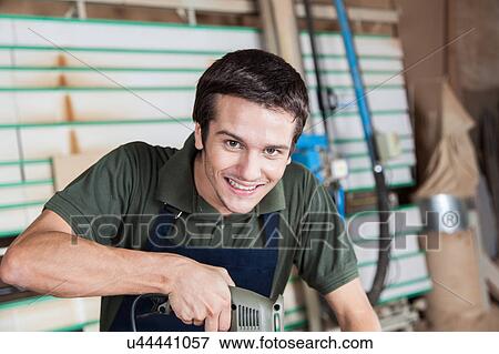 Stock Photo - Happy carpenter. Fotosearch
