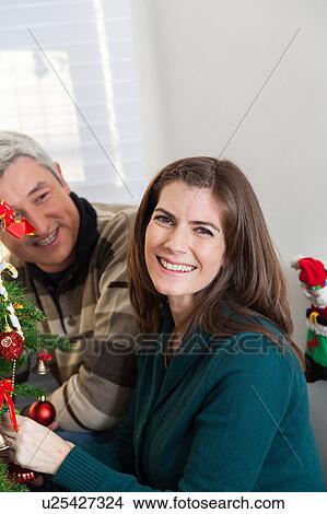 Picture - Happy couple in christmas. Fotosearch