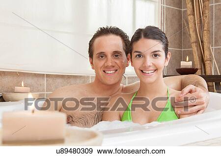 Happy couple relaxed in the tub View Large Photo Image Stock Photo - Happy couple relaxed in the tub. Fotosearch