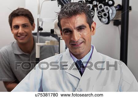 Happy doctor looking at camera View Large Photo Image Stock Image - Happy doctor looking at camera. Fotosearch