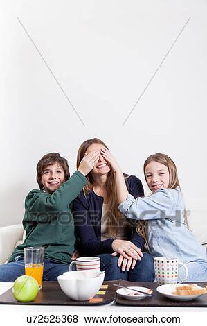 Happy family having the breakfast together View Large Photo Image Stock Photo - Happy family having the breakfast together. Fotosearch