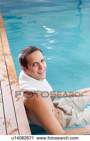 Happy guy relax inside the pool View Large Photo Image Stock Image - Happy guy relax inside the pool. Fotosearch