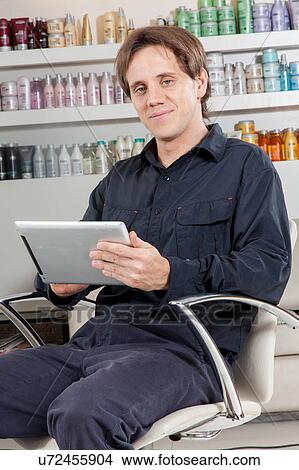 Happy hairstylist looking the camera View Large Photo Image Picture - Happy hairstylist looking the camera. Fotosearch