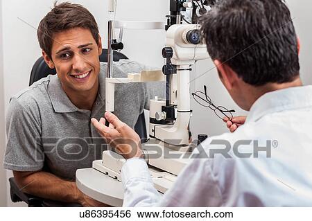 Stock Photograph - Happy man about what the doctor says. Fotosearch