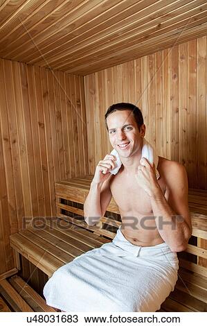 Stock Image - Happy man inside the sauna. Fotosearch