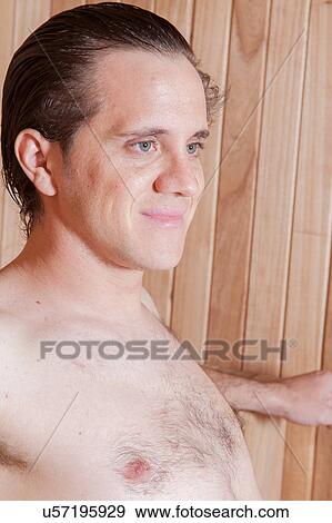 Stock Photo - Happy man inside the sauna. Fotosearch