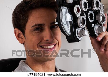 Stock Image - Happy man looking at camera. Fotosearch