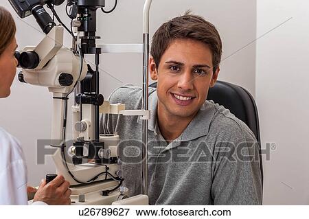 Stock Photo - Happy man looking at camera. Fotosearch