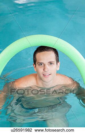 Happy man playing in the pool View Large Photo Image Stock Image - Happy man playing in the pool. Fotosearch
