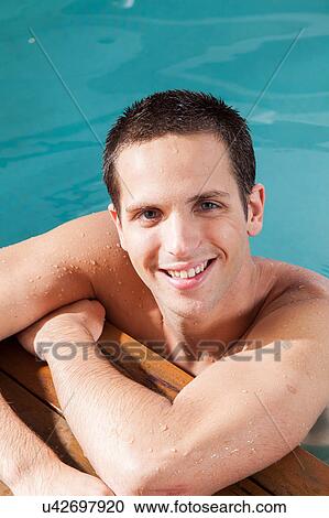 Happy man rest in the edge of the pool View Large Photo Image Stock Image - Happy man rest in the edge of the pool. Fotosearch