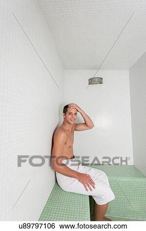 Stock Photograph - Happy man rest inside the sauna. Fotosearch