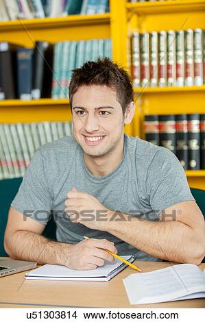Happy man studying View Large Photo Image Picture - Happy man studying. Fotosearch