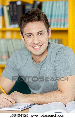 Stock Photography - Happy man writing. Fotosearch