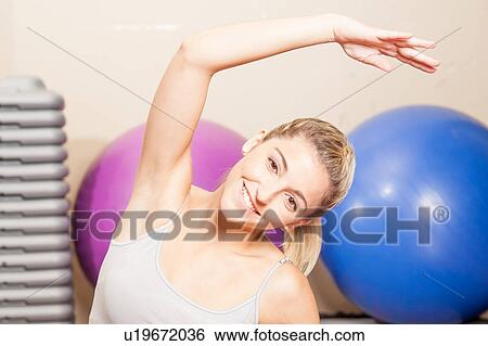 Stock Photograph - Happy woman stretching. Fotosearch