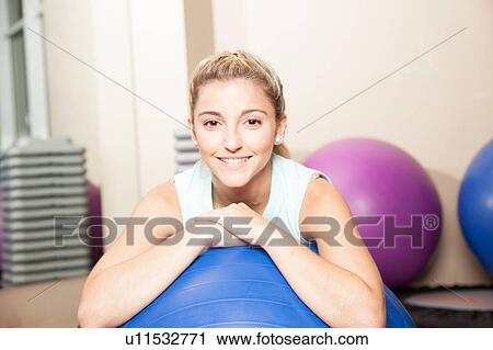 Happy woman waiting for the class of yoga View Large Photo Image Stock Image - Happy woman waiting for the class of yoga. Fotosearch