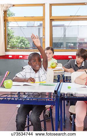 Picture - kids in the classroom. Fotosearch