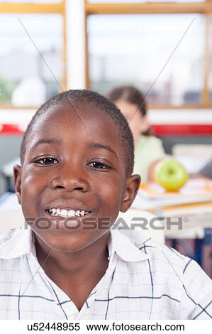 Stock Photography - little boy studying. Fotosearch