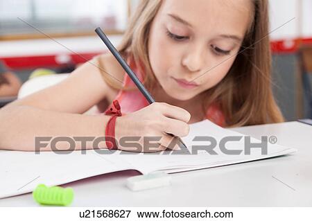 Little girl studying View Large Photo Image Stock Photo - Little girl studying. Fotosearch