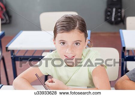 Little girl studying View Large Photo Image Stock Photo - Little girl studying. Fotosearch