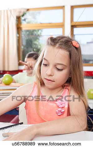 Stock Photo - Little girl studying. Fotosearch
