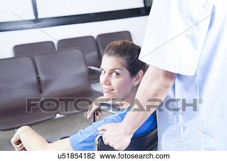 Male nurse helping a woman View Large Photo Image Stock Image - Male nurse helping a woman. Fotosearch