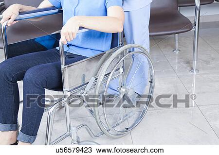 Male nurse helping a woman View Large Photo Image Stock Image - Male nurse helping a woman. Fotosearch