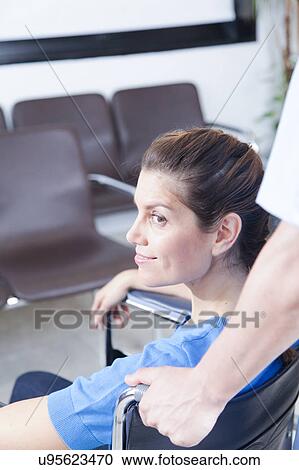 Male nurse helping a woman View Large Photo Image Stock Image - Male nurse helping a woman. Fotosearch