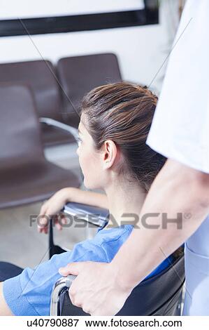 Male nurse helping a woman View Large Photo Image Stock Photo - Male nurse helping a woman. Fotosearch
