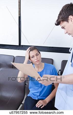 Male nurse helping a woman View Large Photo Image Stock Photography - Male nurse helping a woman. Fotosearch