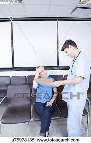 Male nurse helping a woman View Large Photo Image Stock Photography - Male nurse helping a woman. Fotosearch