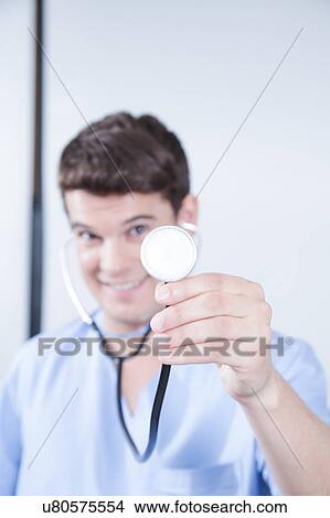 Picture - male nurse working . Fotosearch
