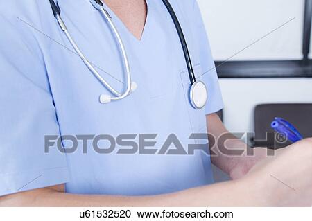 Stock Image - male nurse working . Fotosearch