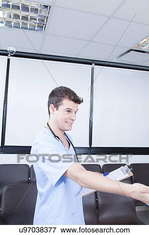 Stock Photo - male nurse working . Fotosearch