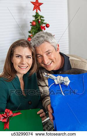 Man and woman with gifts View Large Photo Image Picture - Man and woman with gifts. Fotosearch