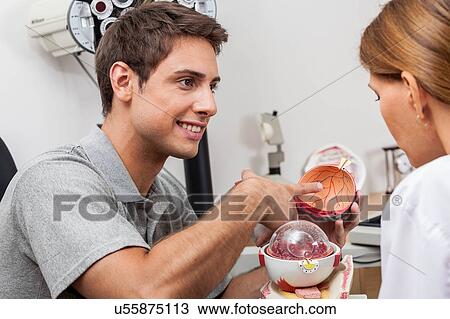 Stock Image - Man asking about the eye. Fotosearch