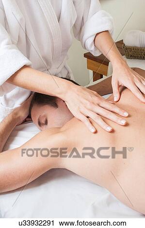 Man back laid receiving massage View Large Photo Image Stock Image - Man back laid receiving massage. Fotosearch