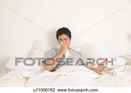 Man blowing his nose View Large Photo Image Stock Image - Man blowing his nose. Fotosearch