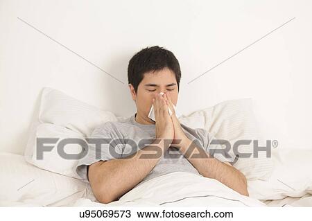 Man blowing his nose View Large Photo Image Stock Image - Man blowing his nose. Fotosearch
