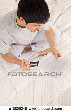 Man buying and reading the contract View Large Photo Image Stock Photograph - Man buying and reading the contract. Fotosearch