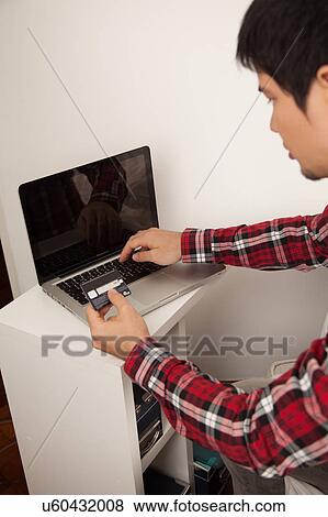 Man buying by network View Large Photo Image Stock Photo - Man buying by network. Fotosearch