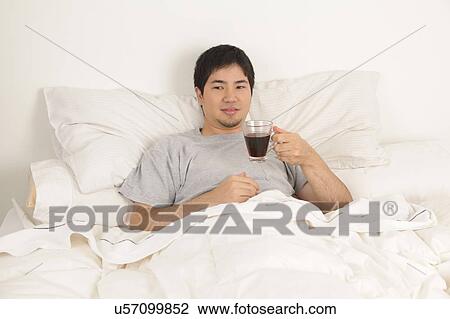 Man drinking a coffee View Large Photo Image Stock Image - Man drinking a coffee. Fotosearch