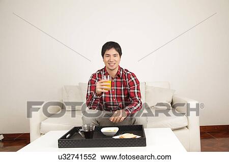 Man drinking a juice View Large Photo Image Stock Image - Man drinking a juice. Fotosearch