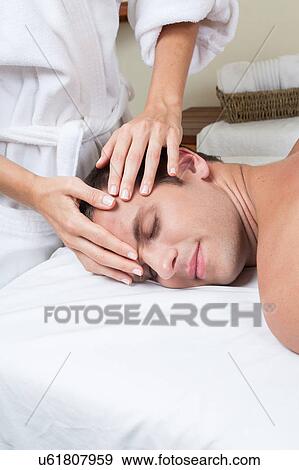 Stock Photo - Man enjoying a massage. Fotosearch