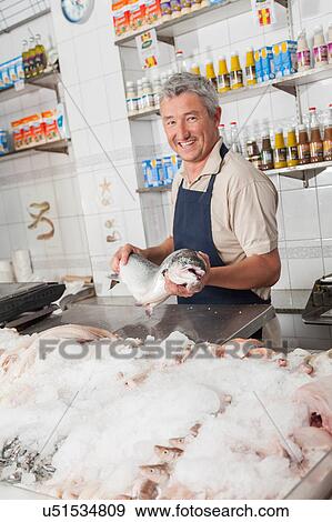 Man exhibiting a pink salmon View Large Photo Image Stock Photo - Man exhibiting a pink salmon. Fotosearch