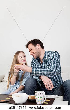 Man gives a toast to his daughter View Large Photo Image Stock Image - Man gives a toast to his daughter. Fotosearch