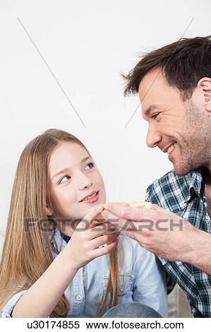 Man giving a toast to his daughter View Large Photo Image Stock Photography - Man giving a toast to his daughter. Fotosearch